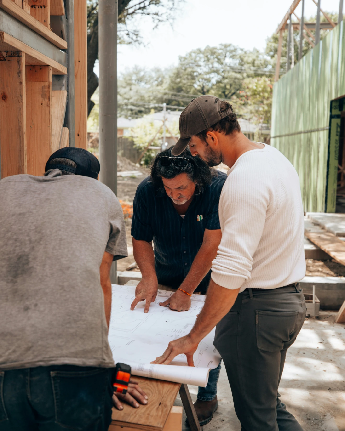 Construction team reviewing plans on site